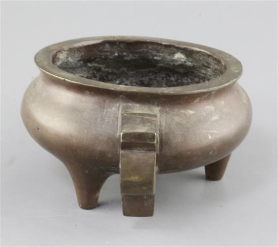 A Chinese bronze ding censer, probably 19th century, width 23.5cm